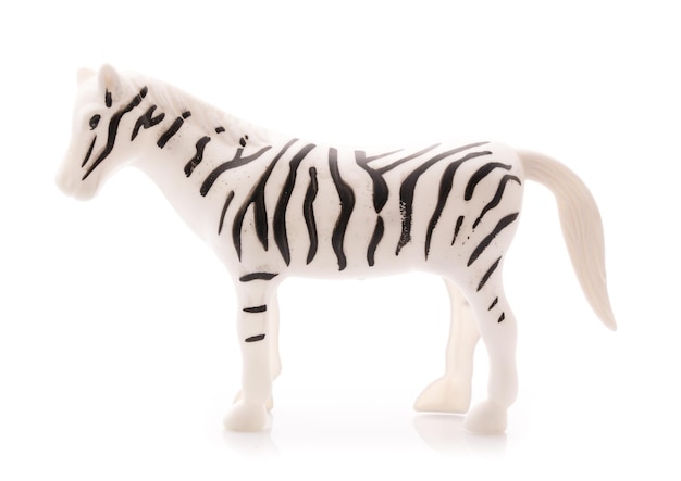 Zebra giocattolo in plastica isolata su sfondo bianco