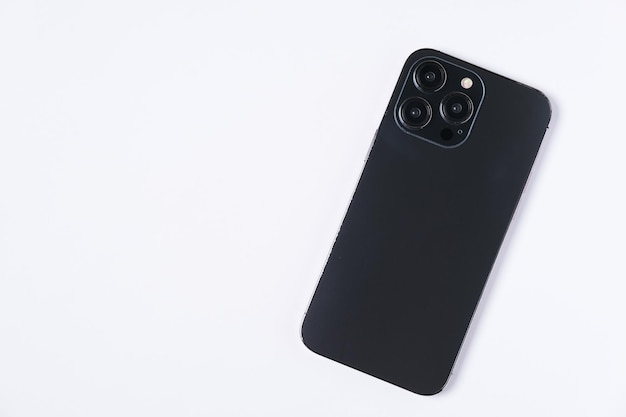 A black iphone with the back of it on a white background