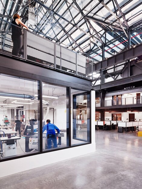 a glass wall that has a man in it