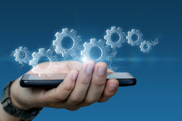 A hand with a phone shows the control mechanism on a blue background