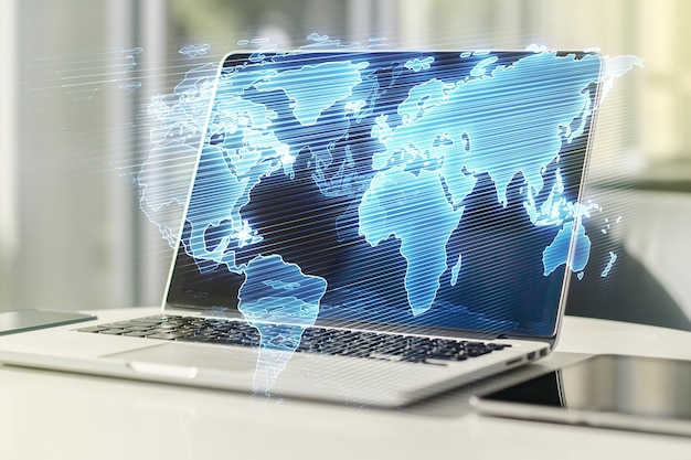 abstract creative world map on modern laptop background international trading concept multiexposure