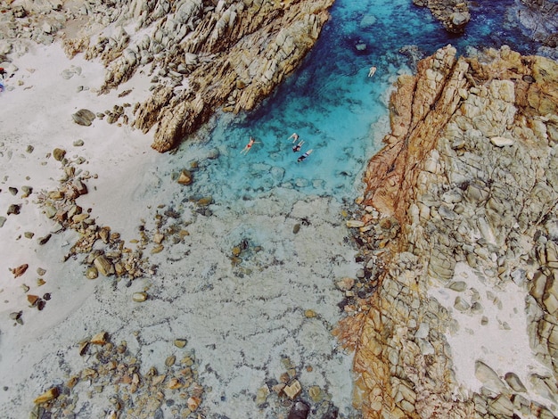 aerial view of rock formation at beach