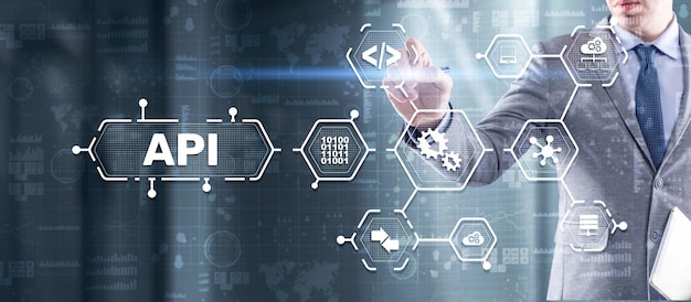 Application Programming Interface API software development tool Information technology concept Businessman presses API text icon on a virtual interface