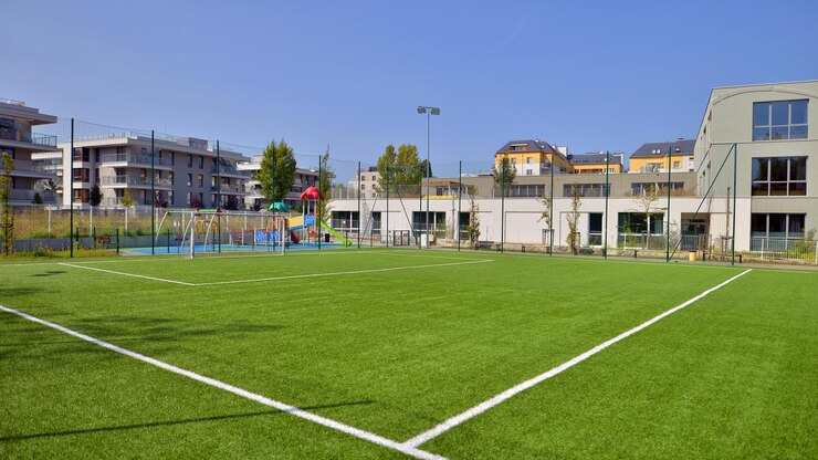 Fotografie artificial turf football pitch near school