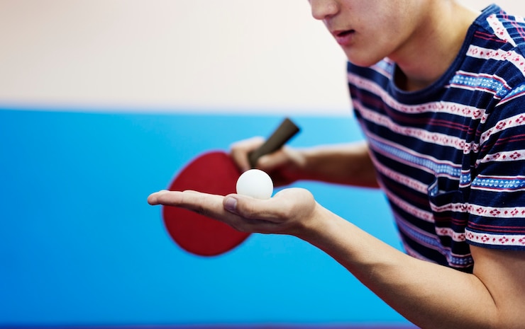 Fotografie asian guy playing table tennis