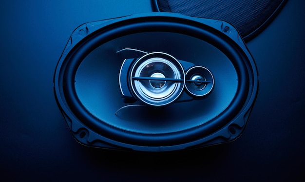 Black car sound speakers closeup on a black background audio system hard bass subwoofer