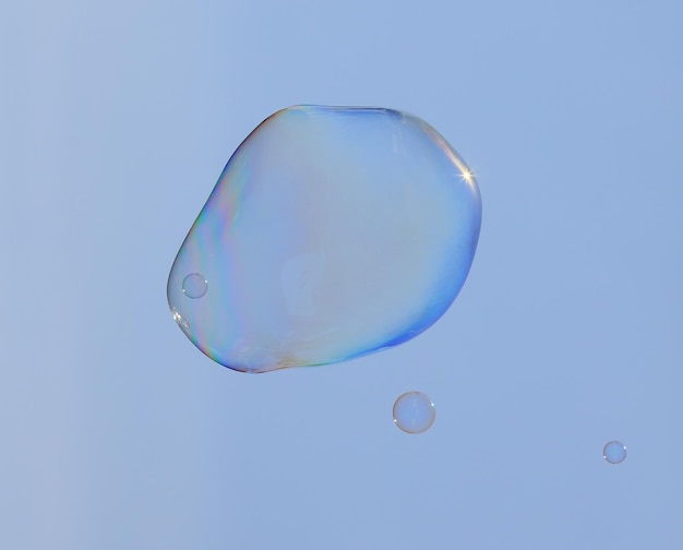 bubble blower on blue sky background