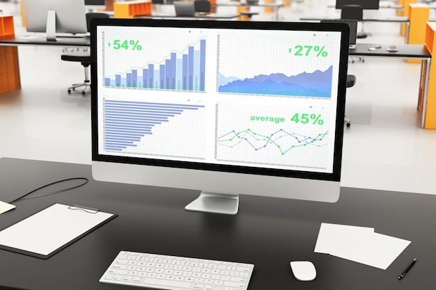 business chart on computer screen with other accessories on black table