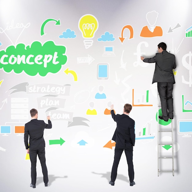 Business team writing against grey background