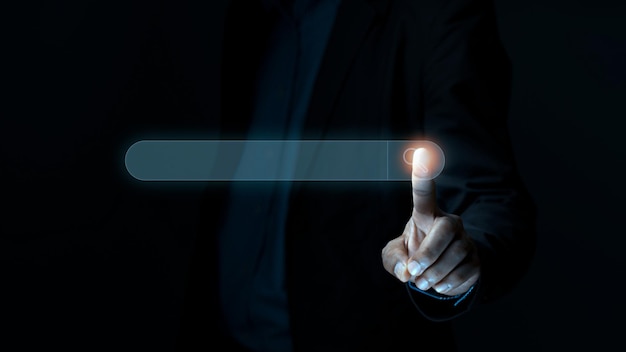 Businessman finger touching with search icon to search engine Optimization or SEO network concept to