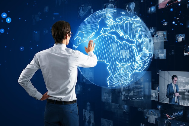 Businessman interacting with digital world map global network theme Dark blue background