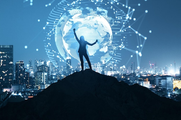 Businesswoman on backlit hill holding abstract polygon globe hologram on illuminated night city background Polygonal network science communication programming and earth concept