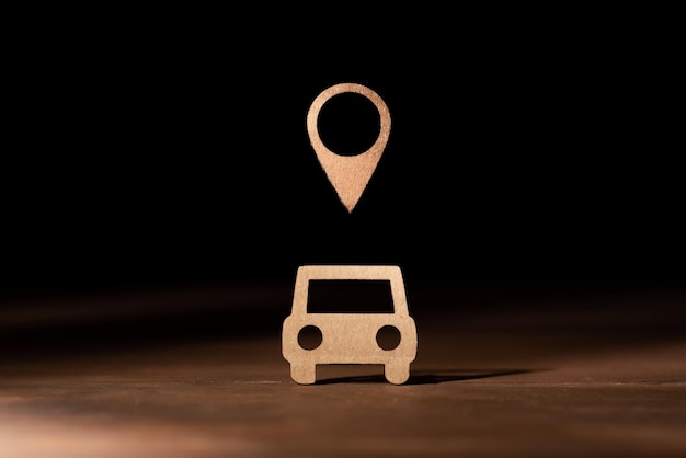 cardboard car with the symbol of position on the map real time location and localization of vehicles