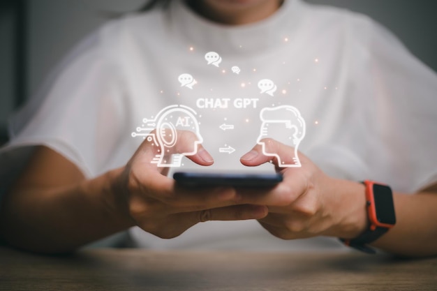 ChatGPT Chat with AI or Artificial Intelligence woman chatting with a smart AI or artificial intelligence using an artificial intelligence chatbot developed by OpenAI