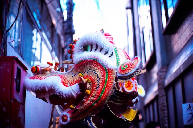 chinese dragon amidst buildings in city at lunar new year