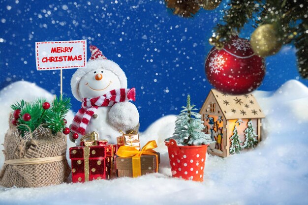 Christmas decorations on snow covered tree