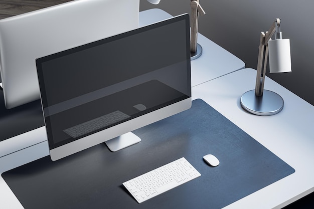 Close up and above view of designer office desk with mock up computer monitor on white desk rug lamp and other items Mock up 3D Rendering