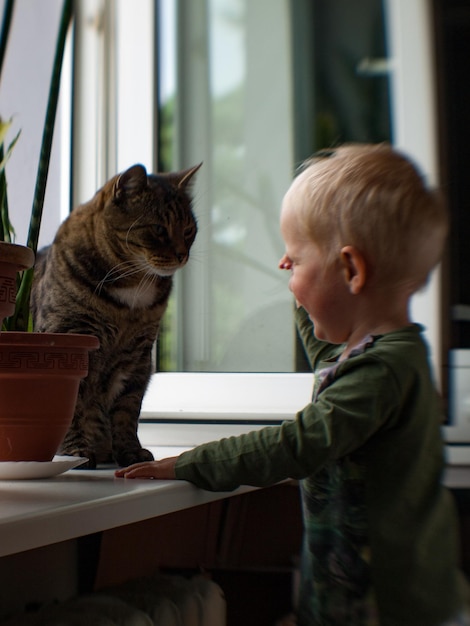 close-up of child with cat