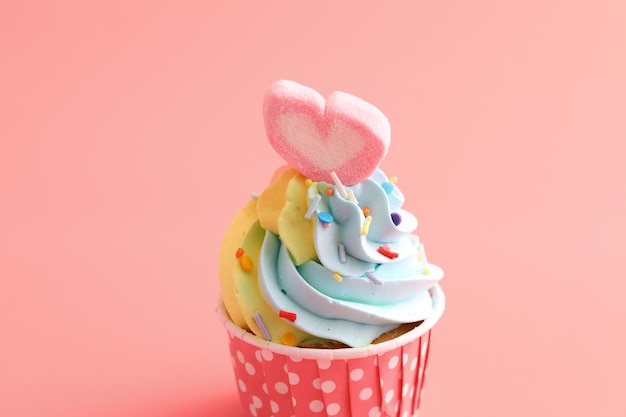 Close-up of cupcakes against pink background