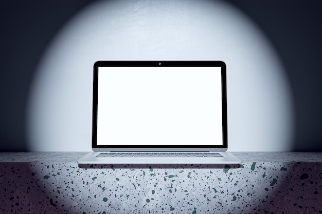 Close up of empty white computer monitor in spotlight Mock up place and advertisement concept 3D Rendering