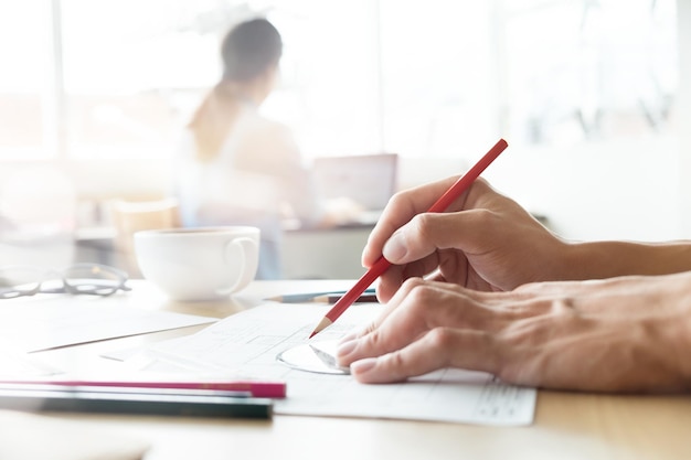 Close-up of man working on paper