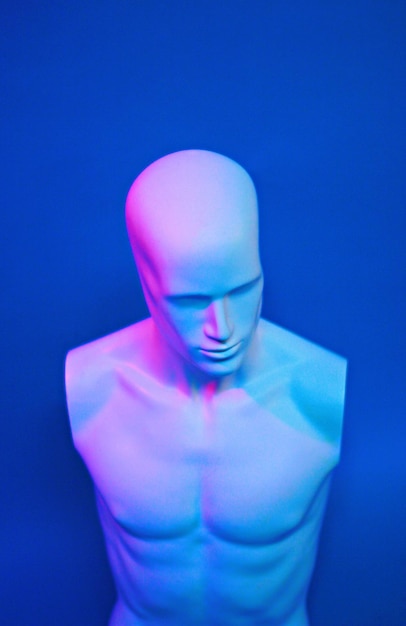 close-up of mannequin against blue background