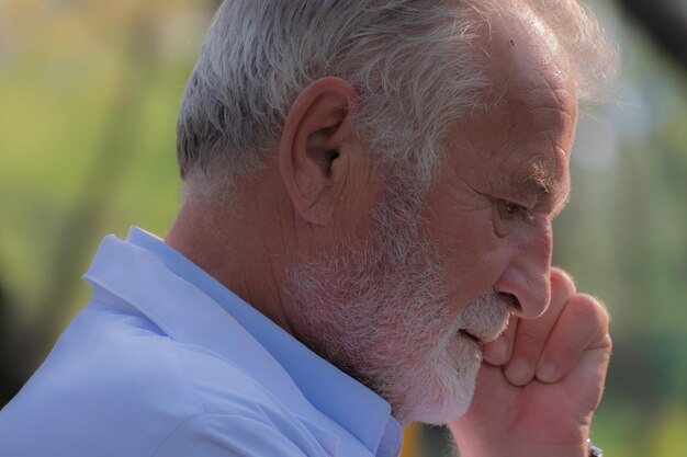 Close-up of senior man looking down