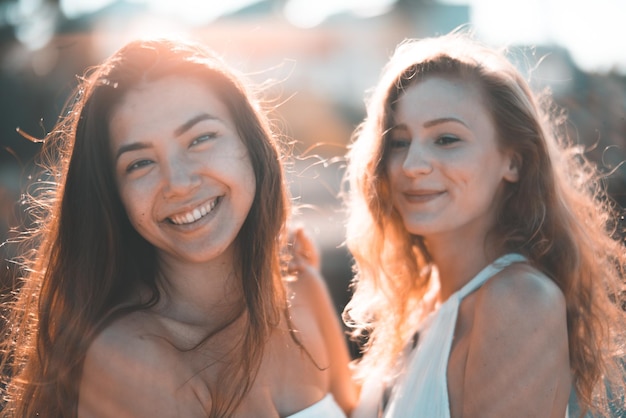 close-up of smiling female friends