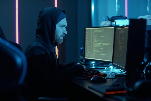 computer hacker installing the program