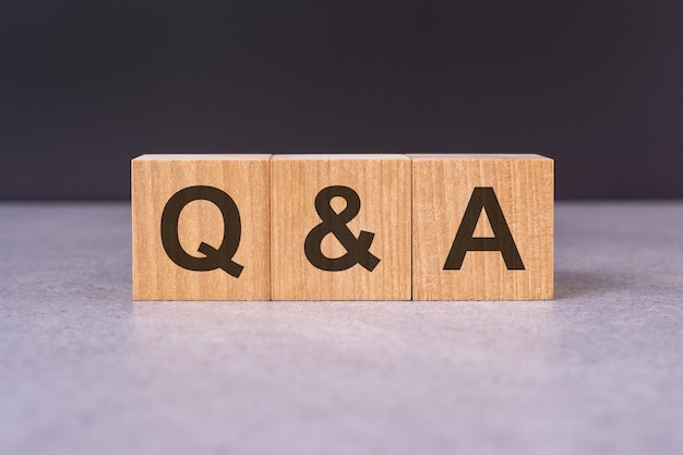 concept word q and a on cubes on a beautiful grey background business concept copy space