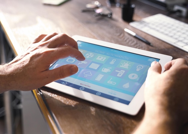 Cropped hand holding digital tablet