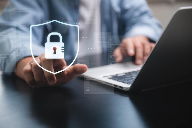 Cyber security network Data protection concept Businessman touching shield with padlock in hand about global network connectivity data protection and network security insurance business