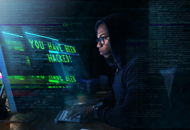 Cyber warfare Cropped shot of a young man hacking into a secure computer network