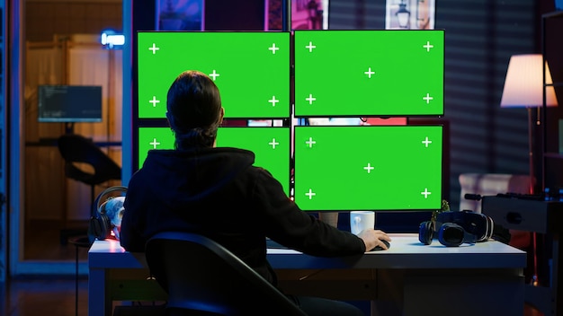 cybercriminal coding on green screen monitors developing zero day exploit