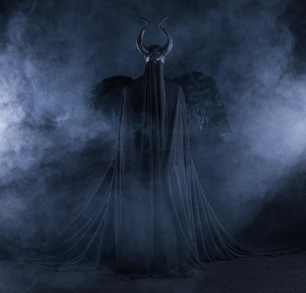 demon angel with white wings on a black background