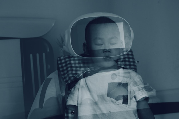 digital composite image of boy sitting on chair