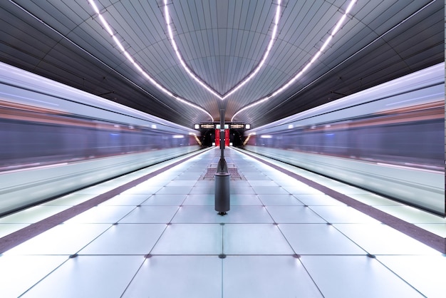 Diminishing perspective of illuminated railroad station platform