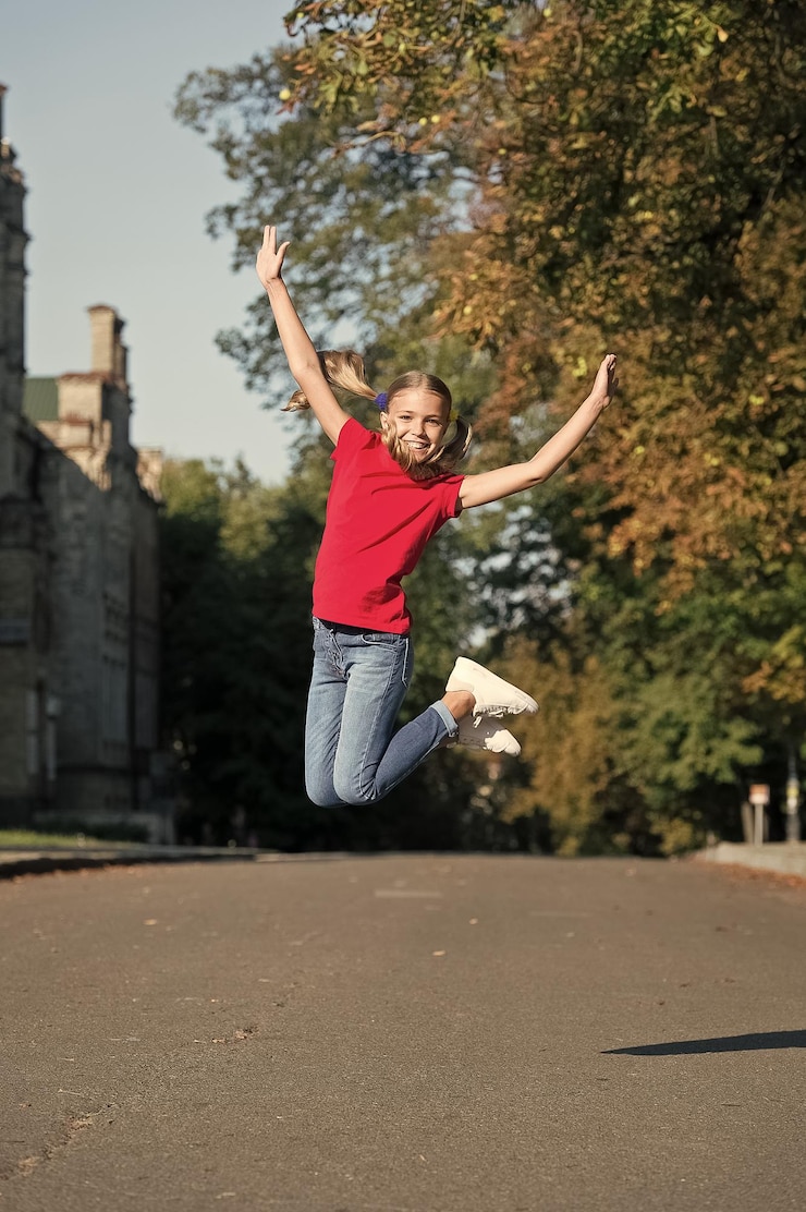 Fotografie do more of what makes you happy happy child jump high outdoors happy childhood having fun raising happy kid school holidays summer vacation international childrens day