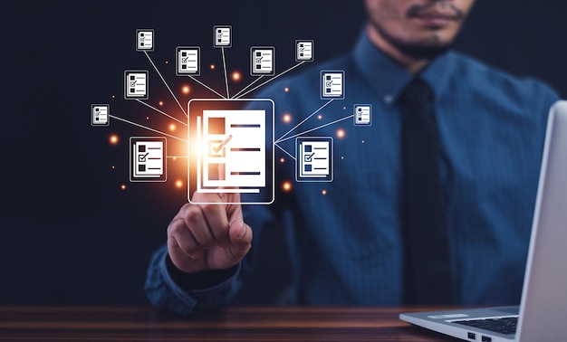 Documents manage program DMSDocument management system concept business man holding document icon software searching and managing files online document database documents manage program DMS