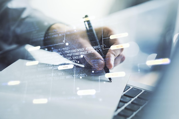 Double exposure of abstract creative programming illustration and hand writing in notepad on background with laptop big data and blockchain concept