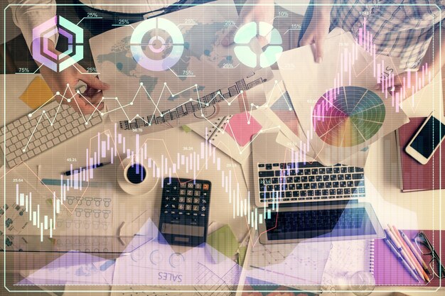 Double exposure of man and woman working together and financial chart hologram drawing market analysis concept Computer background Top View