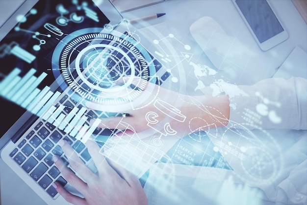 double exposure of woman hands working on computer and financial theme hologram drawing top view business concept