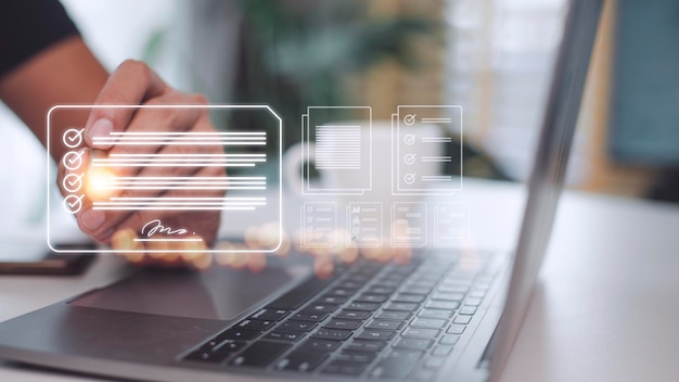 Electronic signature and paperless office concept A person uses a pen to sign electronic documents on digital documents on a virtual screen Esigning Technology and document management