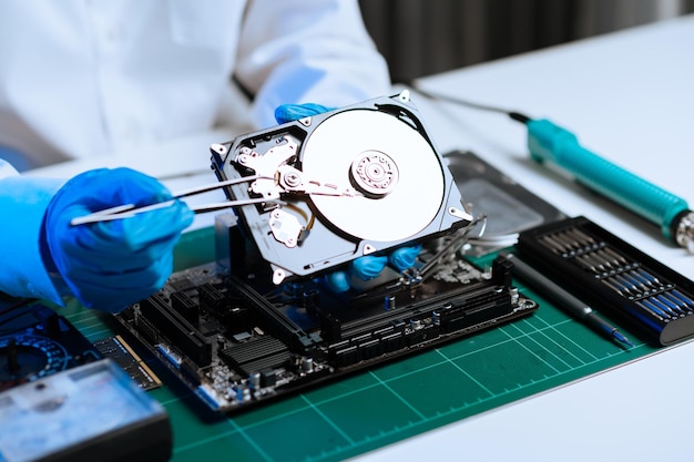 Electronics technician electronic engineering electronic repair electronics measuring and testing repair and maintenance conceptsuses a voltage meter to check and upgrade in shopxA