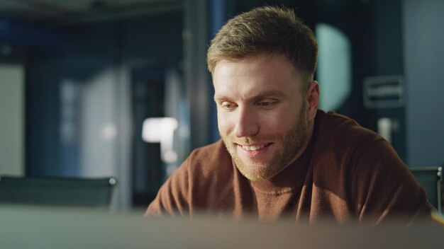 Entrepreneur waving video call in office closeup smiling businessman greeting