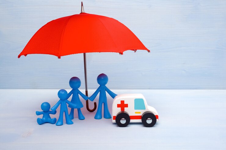 Fotografie family of four under a red umbrella