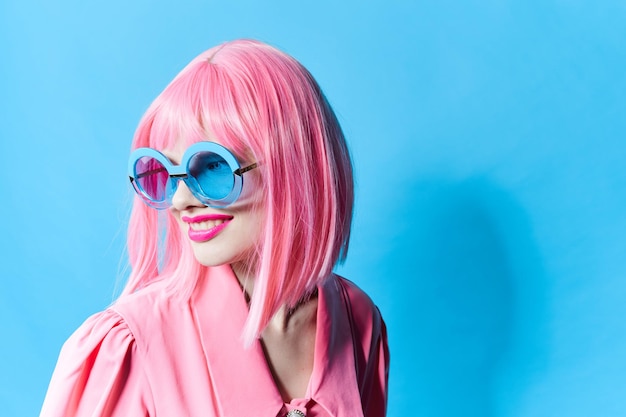 fashionable woman in pink wig pink dress red lips studio model unaltered high quality photo