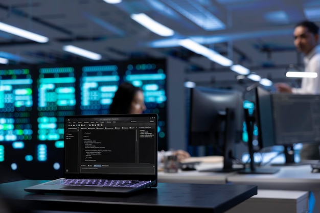 focus on laptop used by it developer in server room to find network issues