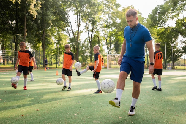 football trainer teaching his pupils