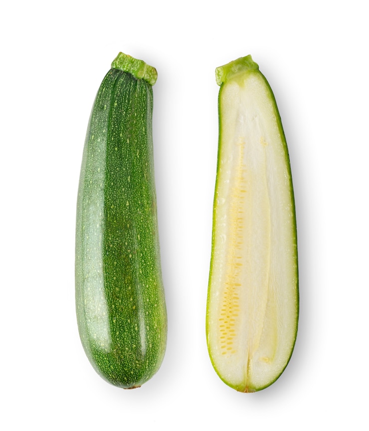 Fotografie fresh zucchini on white backgroundd. top view